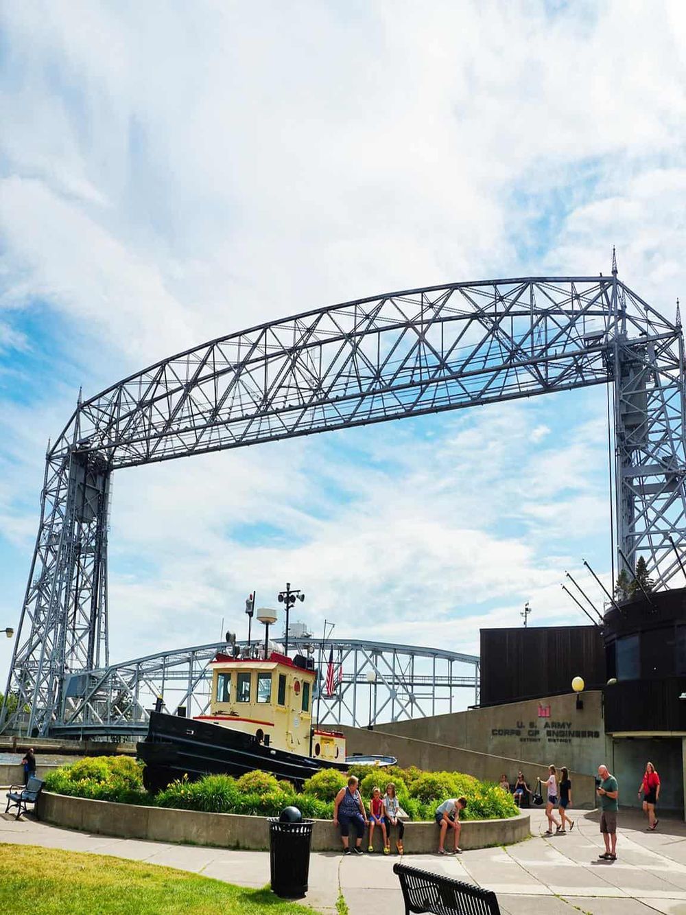 Historic U.S. Coast Guard ship exhibit at Quest for Directions museum, with roller coaster in background.