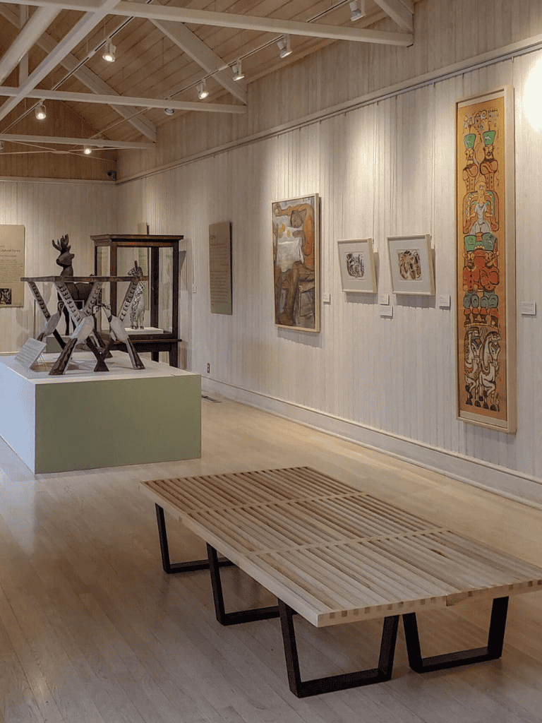 Bronze sculpture exhibit at QuestForDirections art gallery with contemporary paintings and indigenous art pieces.