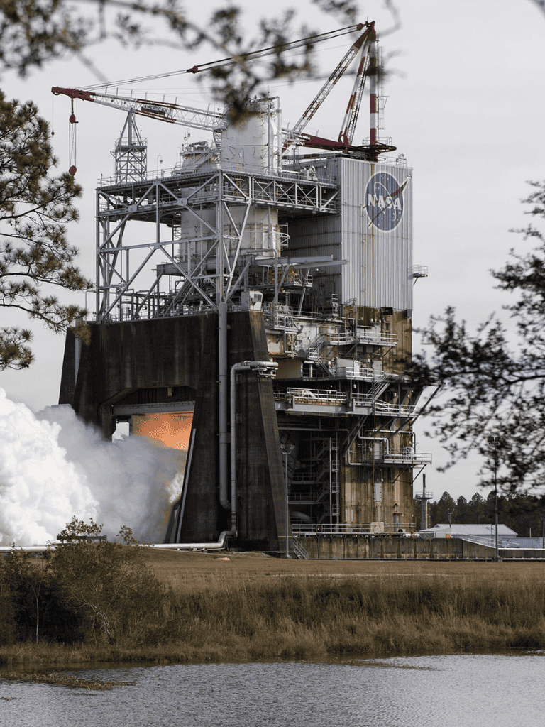 1. Rocket launch pad infrastructure at NASA with a space shuttle ready for launch.