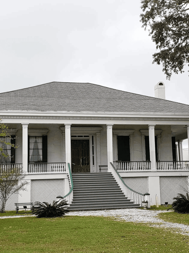 Elegant historic house with grand staircase, perfect for destination weddings and events.
