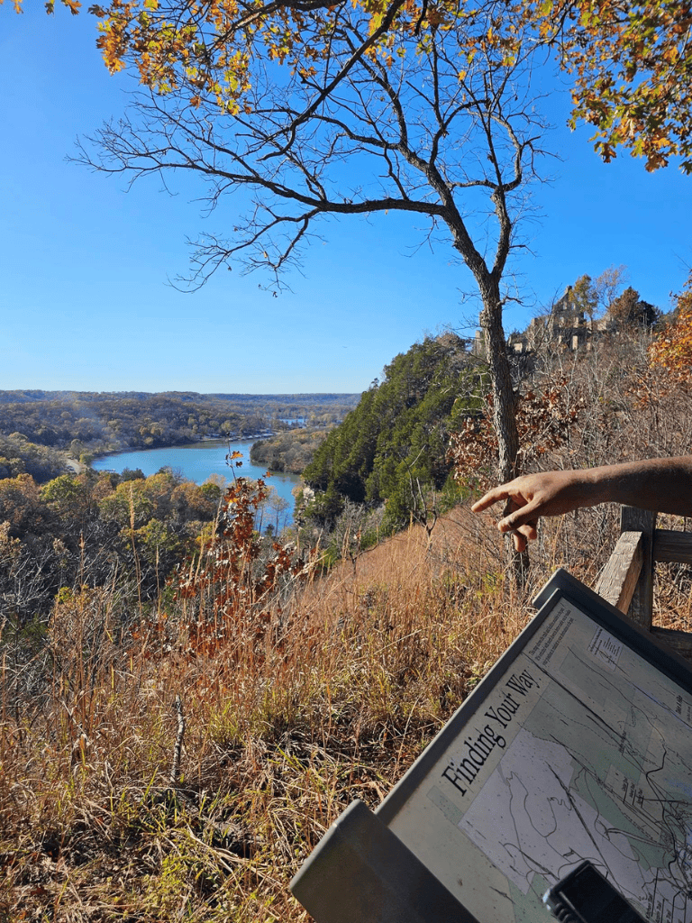 Vast scenic river valley with lush greenery and clear blue sky, ideal for outdoor adventures and nature exploration.