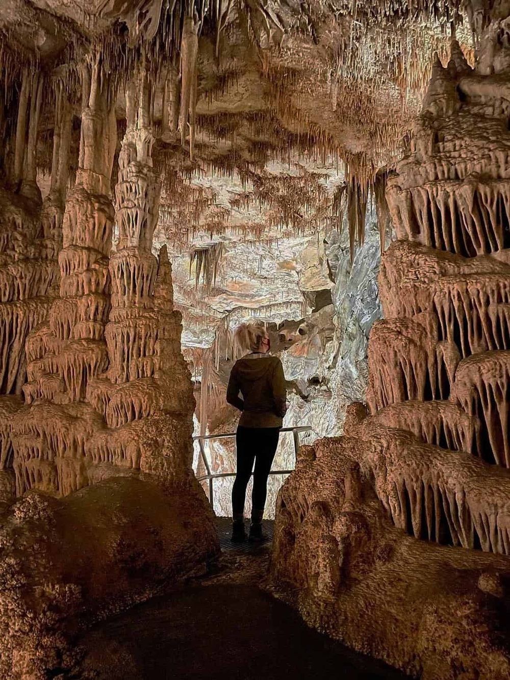 Stunning limestone cave interior with stalactites and stalagmites, explore geological formations with QuestForDirections.