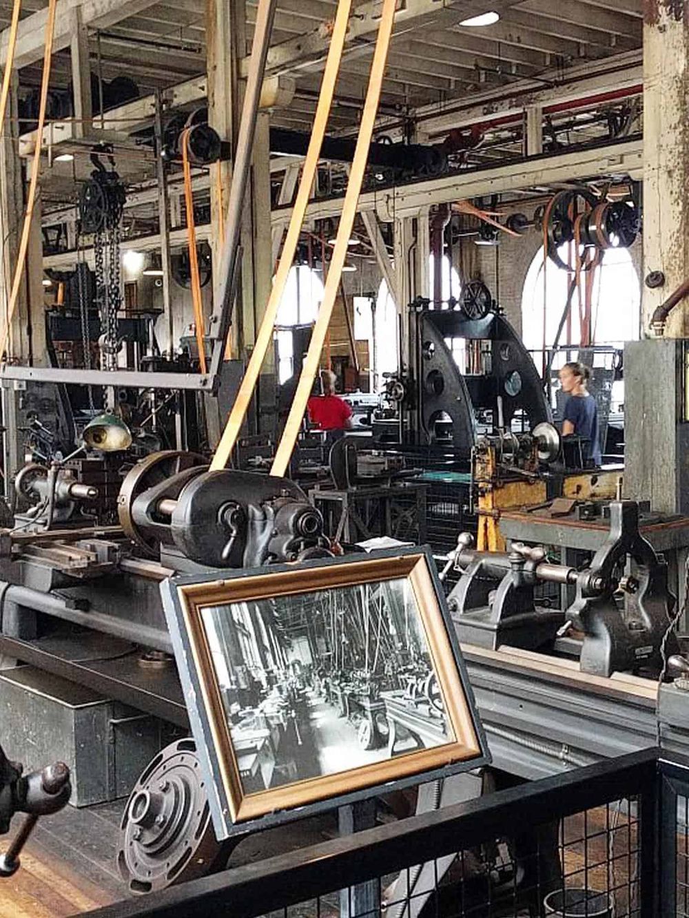 Vintage industrial machinery workshop interior with metal tools and equipment for manufacturing.