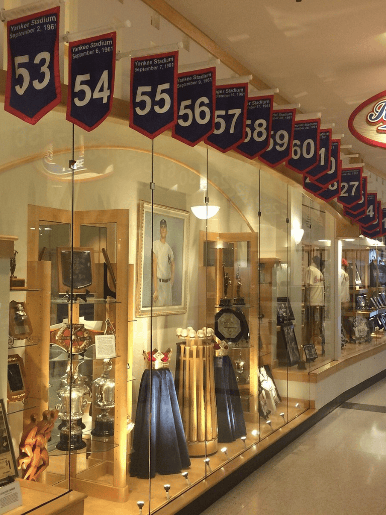 Yankee Stadium banners from September 1961 displayed at QuestForDirections sports memorabilia store.