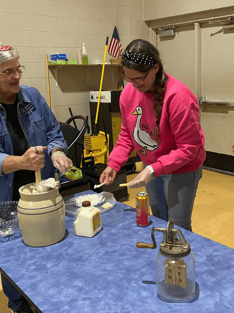 Homemade ice cream making activity at QuestForDirections event, people enjoying fun kitchen experiment.