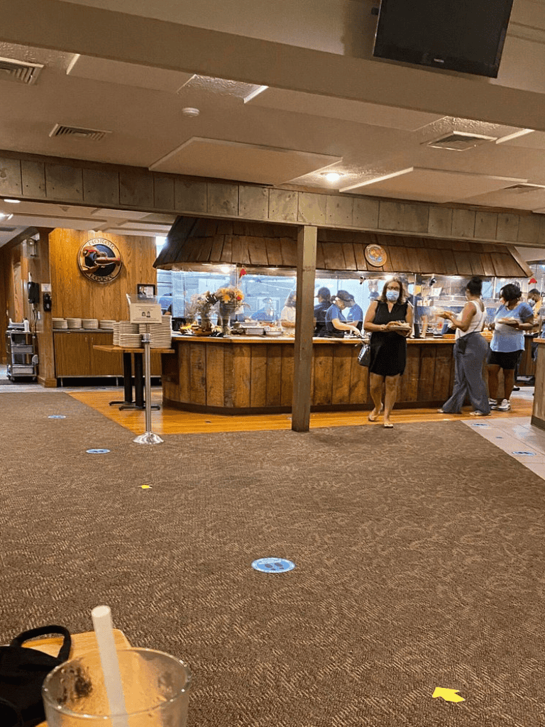 Comfortable indoor dining at QuestForDirections restaurant with social distancing measures in place.