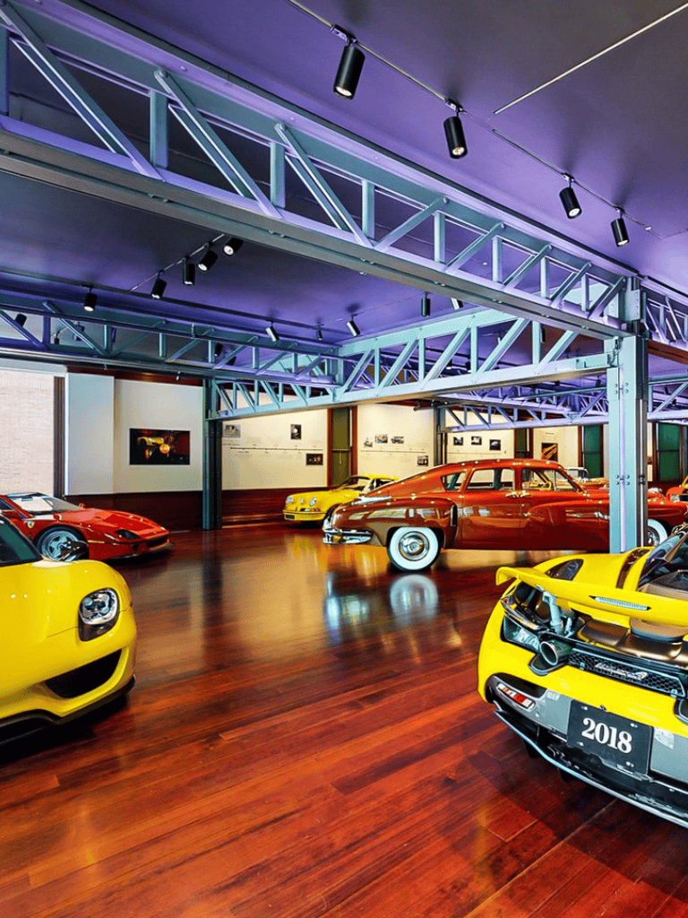 Luxurious sports cars on display at QuestForDirections car museum, showcasing rare exotic vehicles and vintage classics.