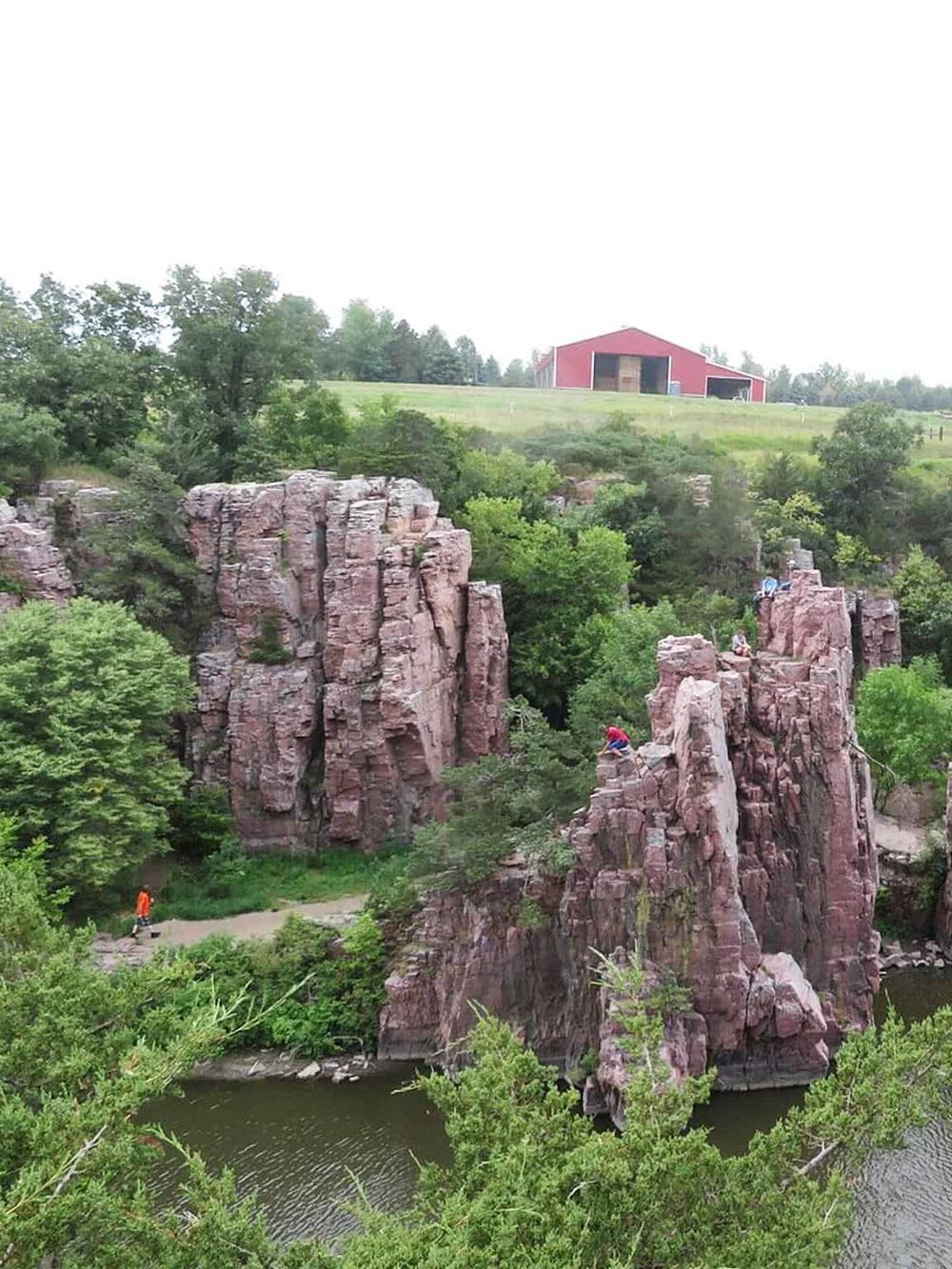Vibrant rock formations and lush greenery at Quest for Directions, showcasing outdoor adventure and scenic nature in Minnesota.