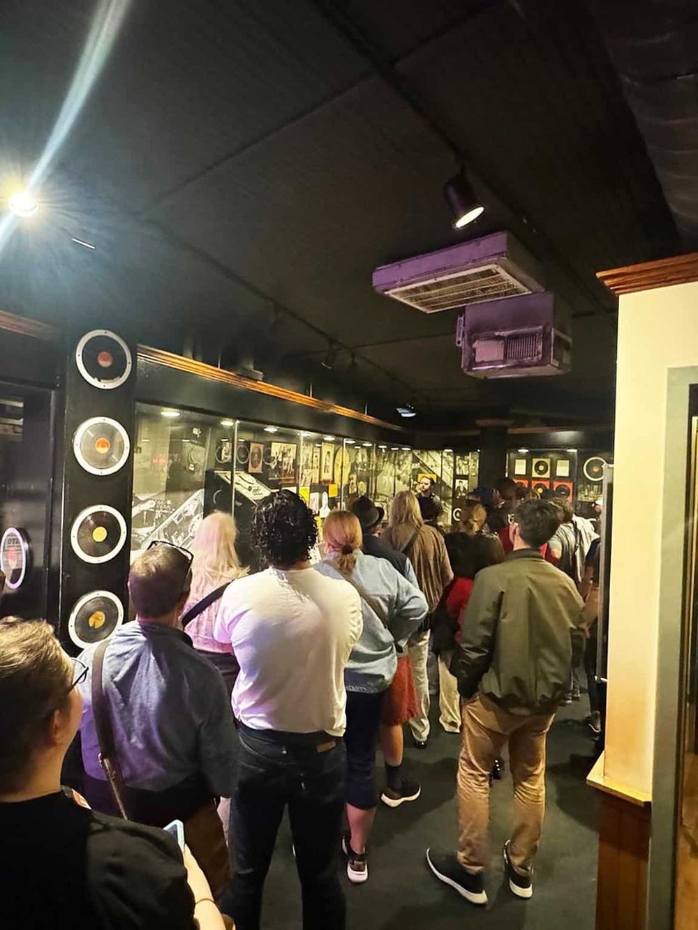 Lively crowd at QuestForDirections music venue during a live performance or event.