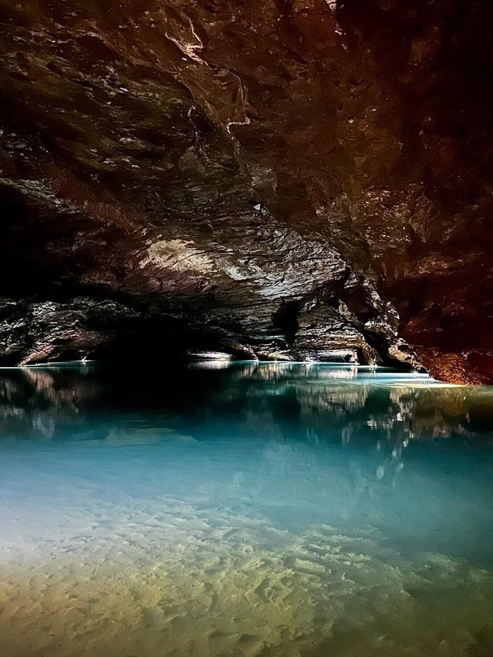Hidden cave water scenic underground exploration adventure.