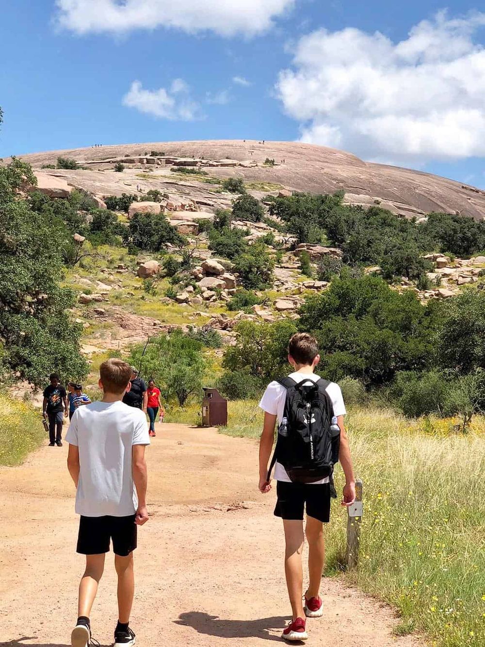 Scenic Stone Mountain hike with children exploring nature and outdoors in Georgia, summer weather, family outdoor activity.