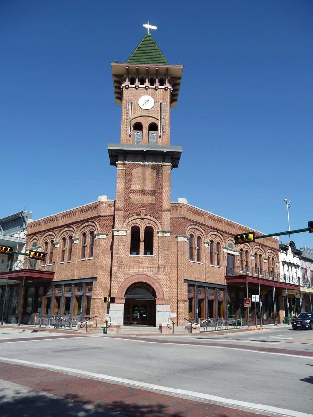 Historic brick town hall with clock tower in downtown.