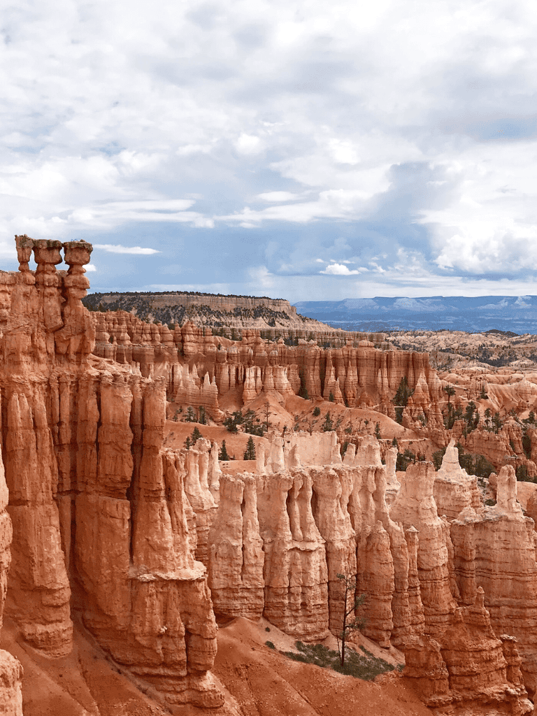 Vivid view of Bryce Canyon's hoodoos and red rock formations, perfect for exploring scenic Utah adventures.