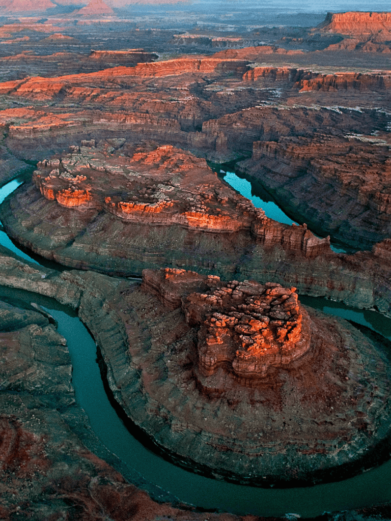 Grand Canyon with Colorado River at sunset, scenic canyon landscape, Utah natural wonders, travel and adventure destination.
