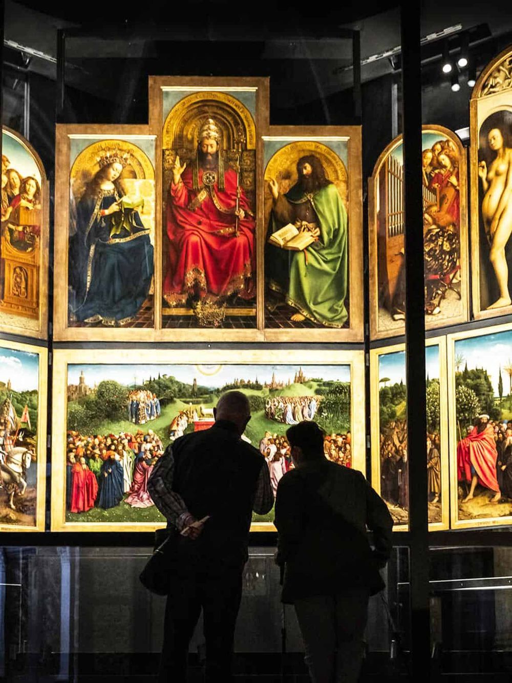 Intricate religious art display at QuestForDirections museum, showcasing famous Renaissance paintings and religious icons.