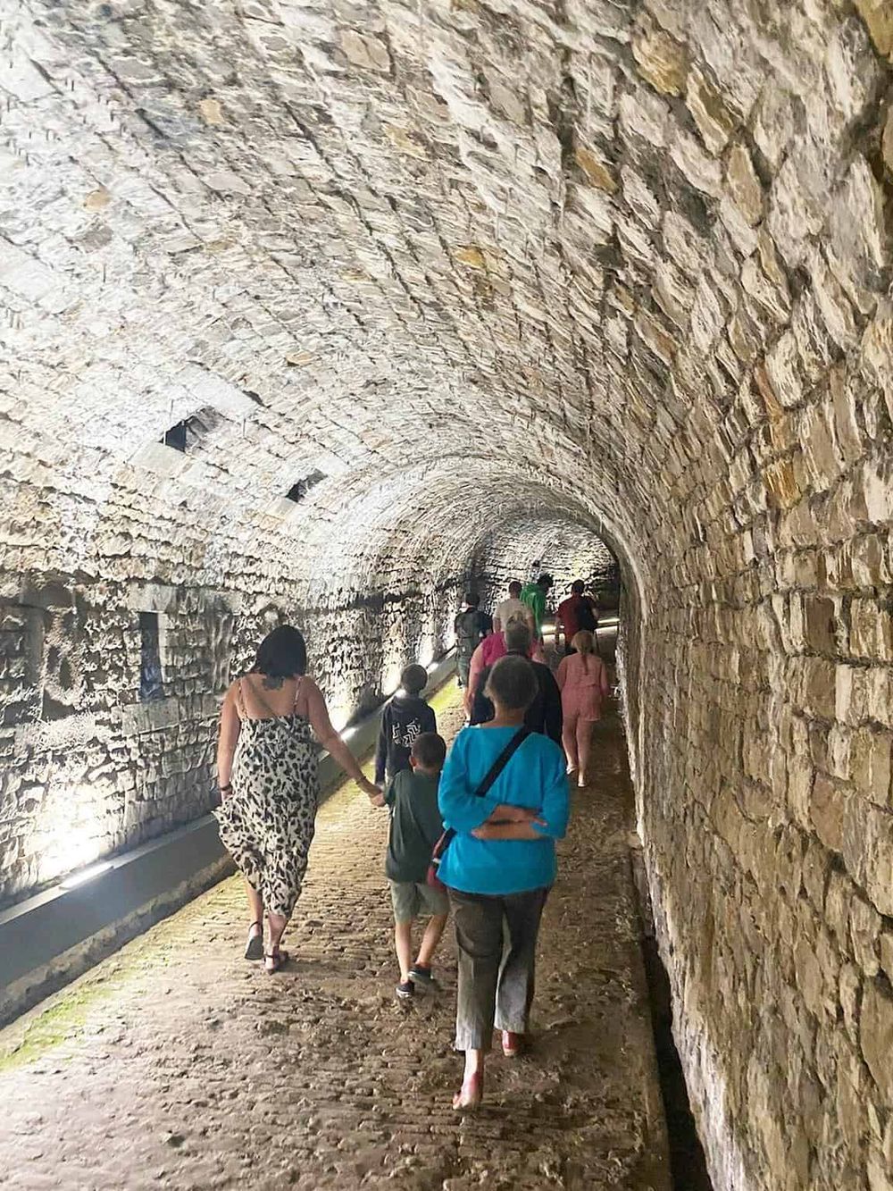 Historic stone tunnel exploring for travelers and adventure seekers.
