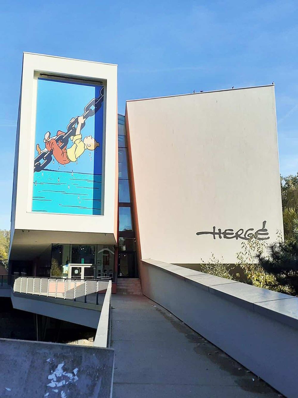 Bright modern building featuring a colorful cartoon mural, promoting fun and creativity at Quest For Directions.