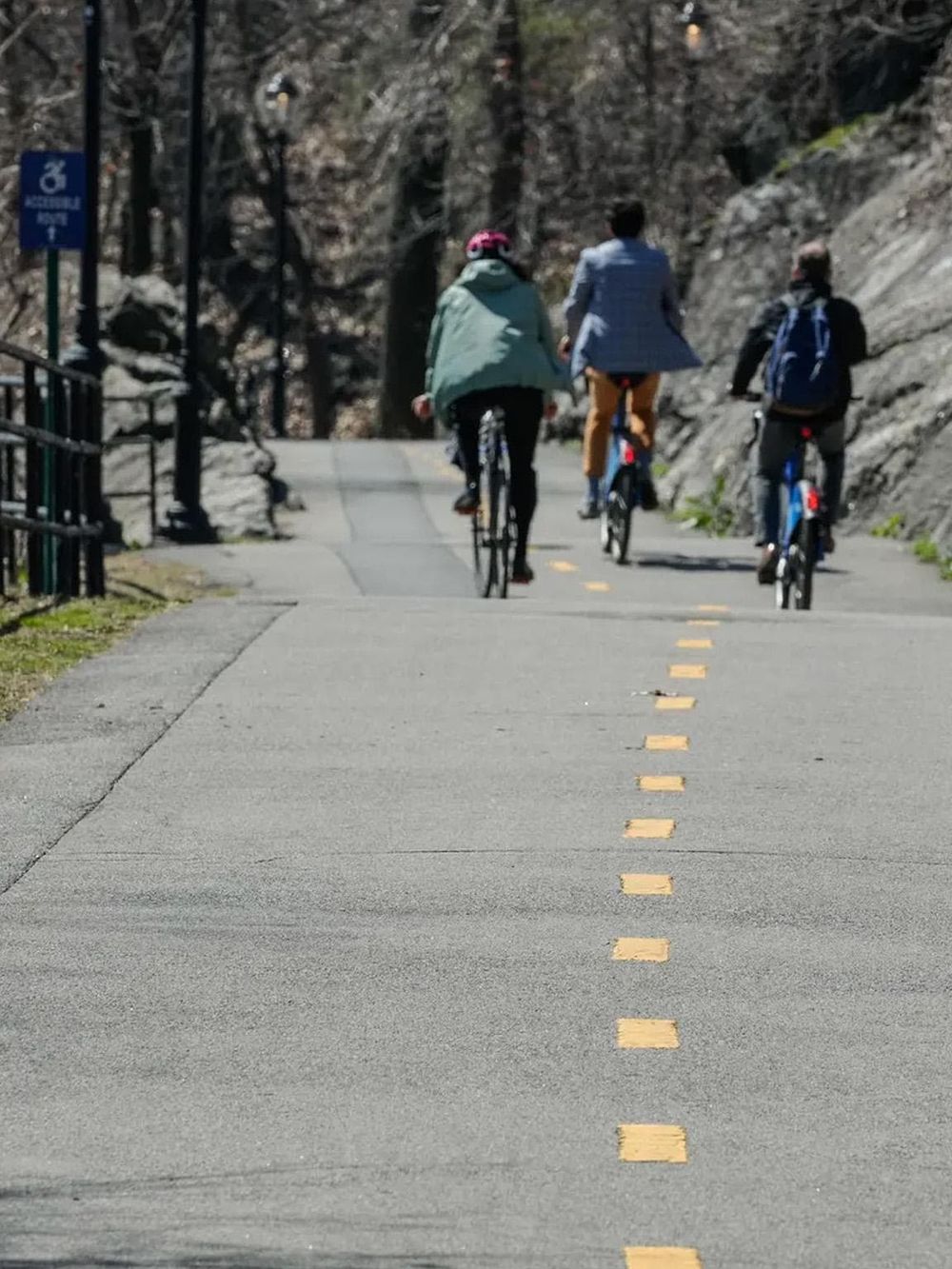 Bicycle trail in scenic outdoor park with people riding bikes, nature, recreation, and adventure.