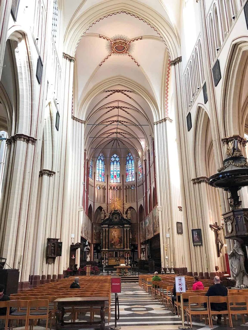 St. Mary's Cathedral interior, Gothic architecture, stained glass windows, religious art, tall vaulted ceilings.