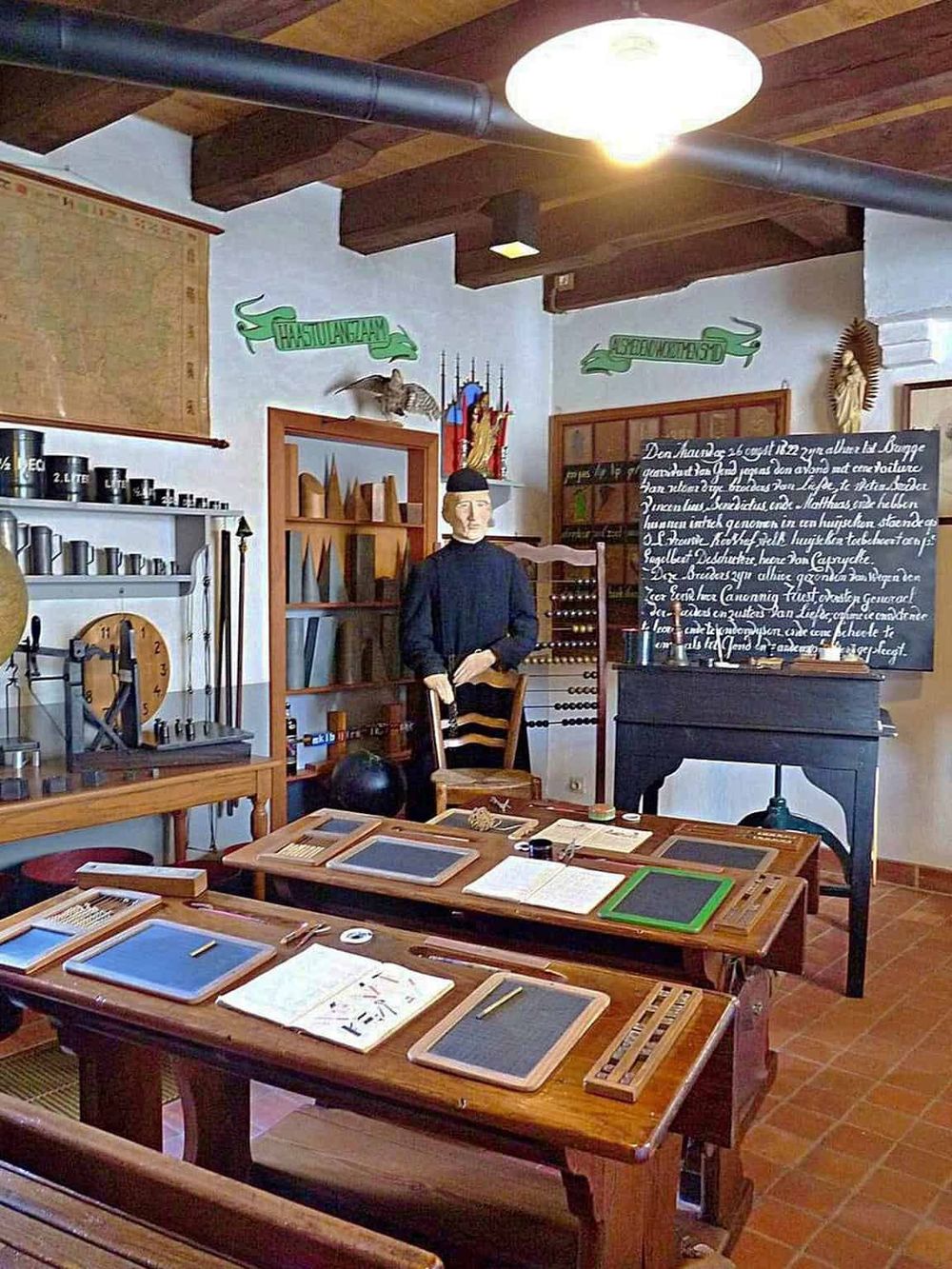 Antique classroom with vintage educational tools, blackboard, and historical decor; ideal for history and education enthusiasts.