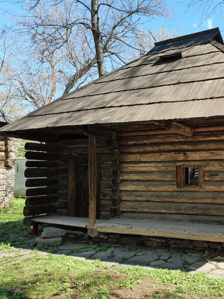 Rustic wooden cabin with historical charm, perfect for outdoor adventure and camping.
