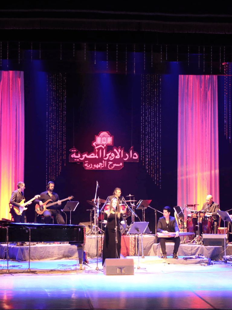 Elegant live musical performance with diverse band members on stage at Quest for Directions event.