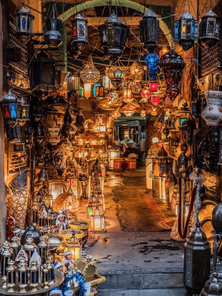 Colorful Moroccan lanterns and lamps in a cozy bazaar shop, perfect for authentic Middle Eastern decor.