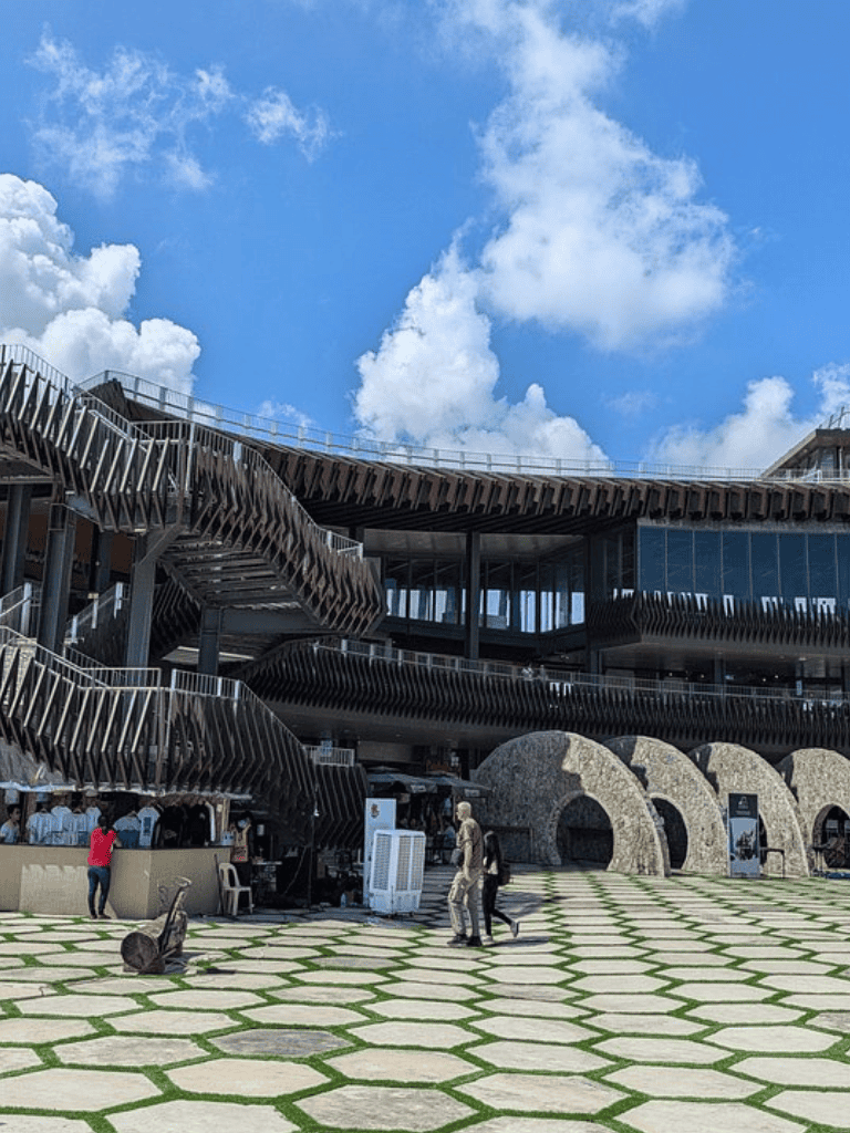 Modern architectural building with outdoor staircase and people, QuestForDirections travel destination.