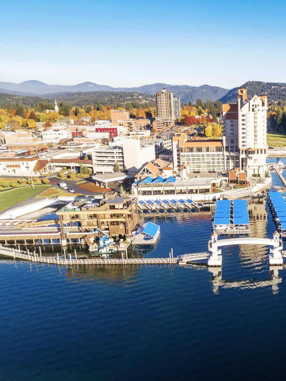 Vancouver waterfront with boats, docks, and cityscape in the background.