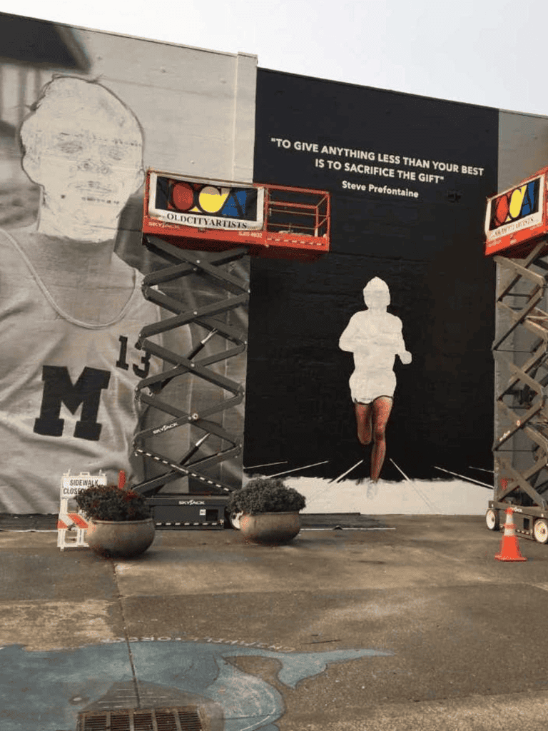 Colorful mural art installation of a basketball player at QuestForDirections, promoting creativity and local art.