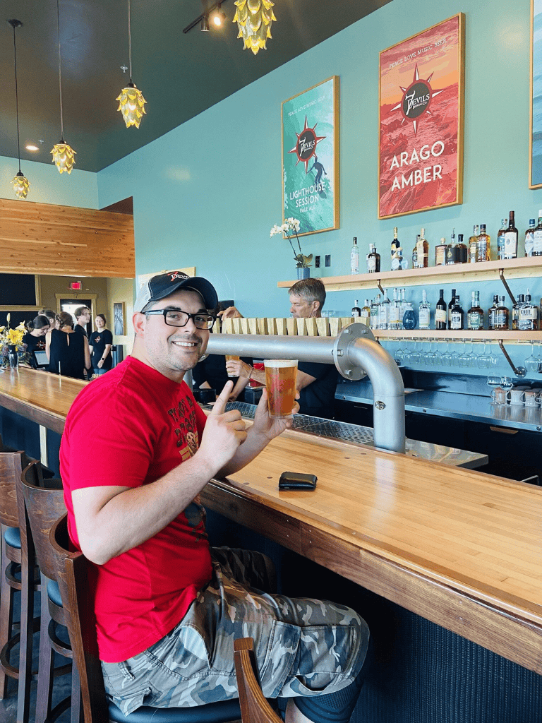 Enjoying craft beer at QuestForDirections brewery with a friendly atmosphere and unique decor.