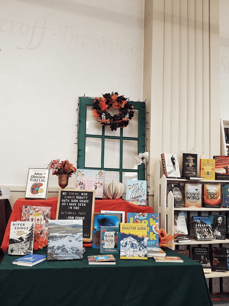 Atlas of Obscure Wild Life book display at Quest for Directions, bookstore featuring nature and travel titles.