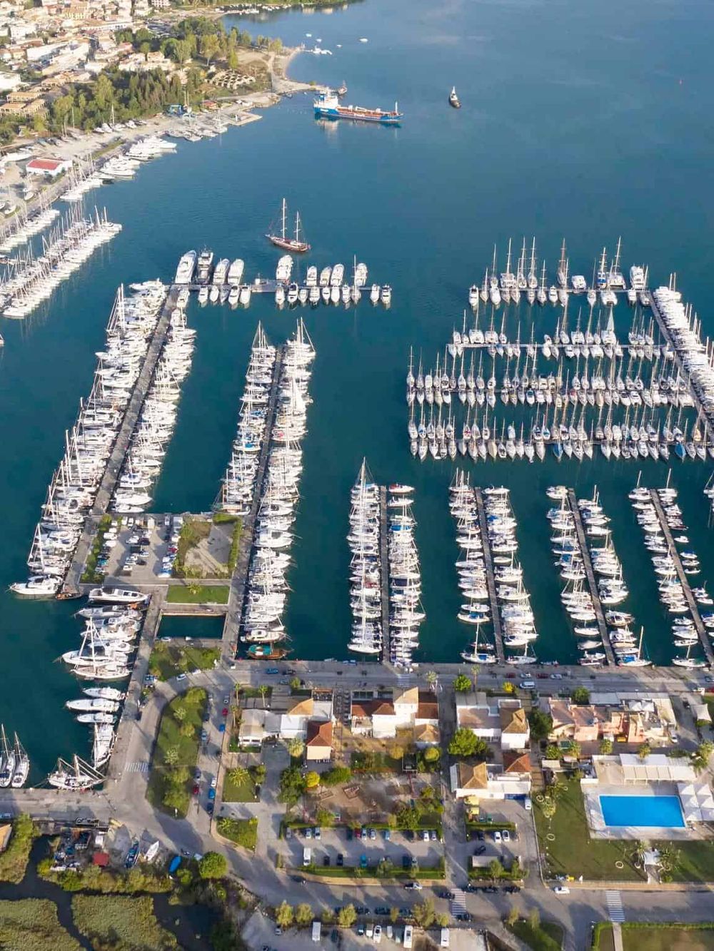 Luxury yacht marina in Quest for Directions waterfront, vibrant boating destination, scenic coastal view.