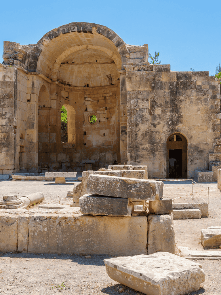 Ancient stone ruins of a historical temple or building in daylight, archaeological site preservation.