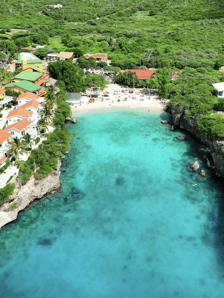 Pristine beach with turquoise waters and lush green surroundings in Puerto Rico.