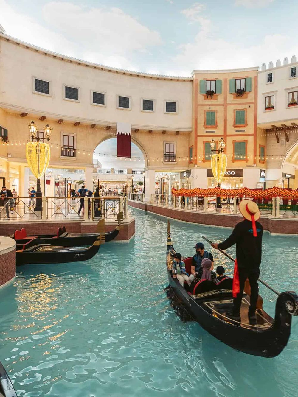 Gondola rides at QuestForDirections shopping mall, Venice-inspired canal with shopping and entertainment.