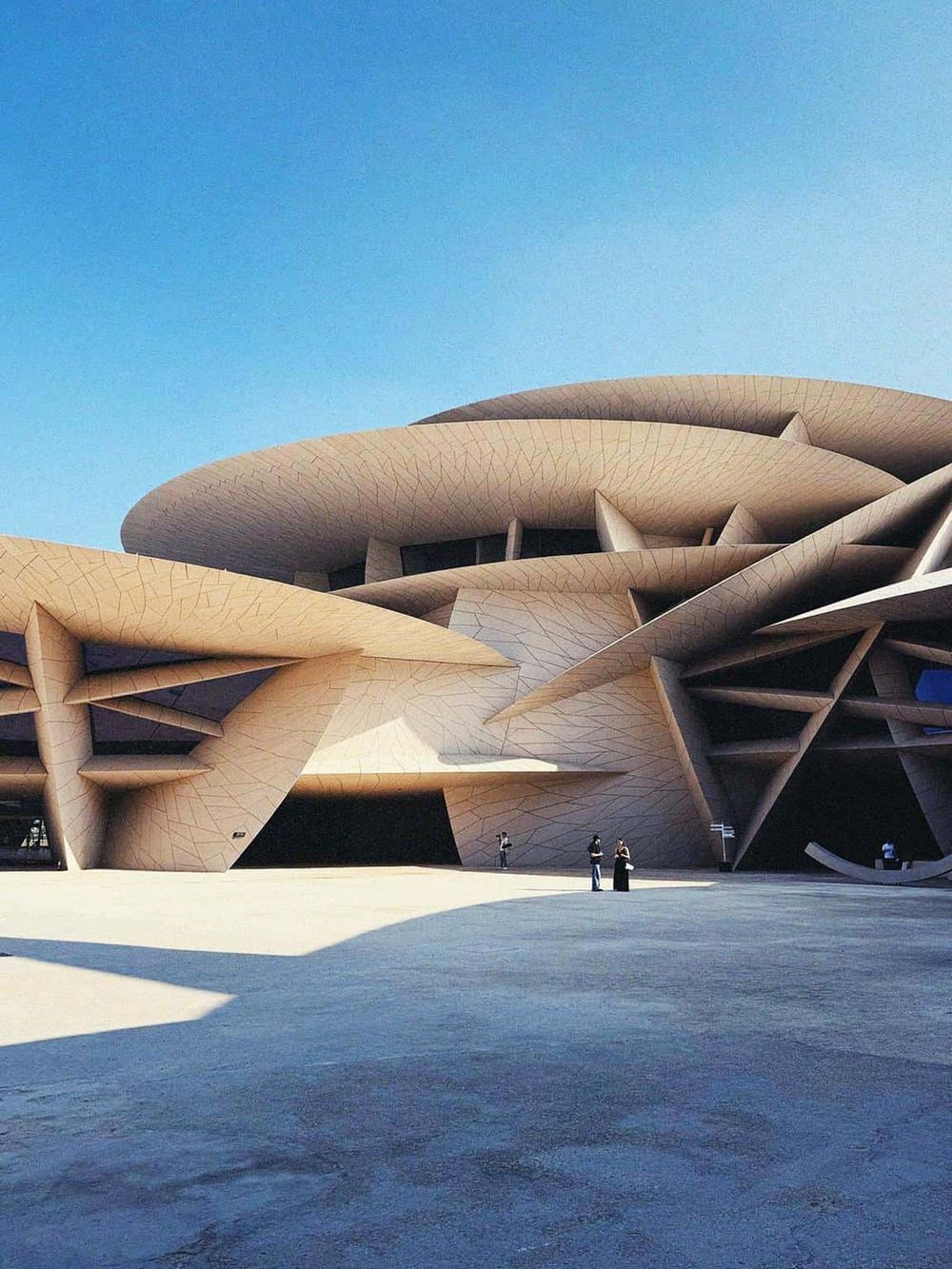 Futuristic building designed by renowned architect, showcasing modern architecture for QuestForDirections site.