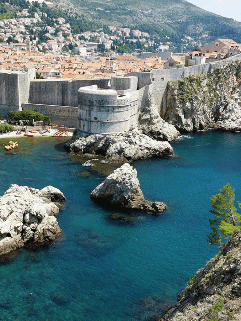 Historic coastal fortress with scenic ocean views, located in scenic Mediterranean seaside town.