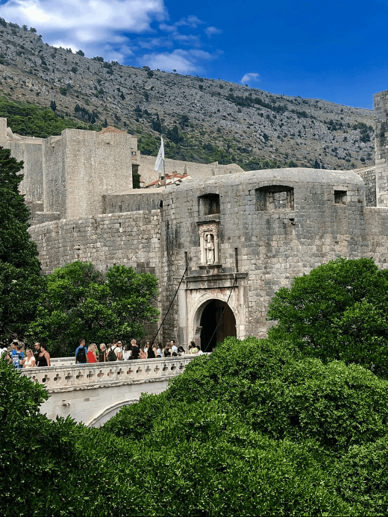 Ancient fortress with stone walls and lush greenery, popular tourist attraction in Dubrovnik, Croatia.