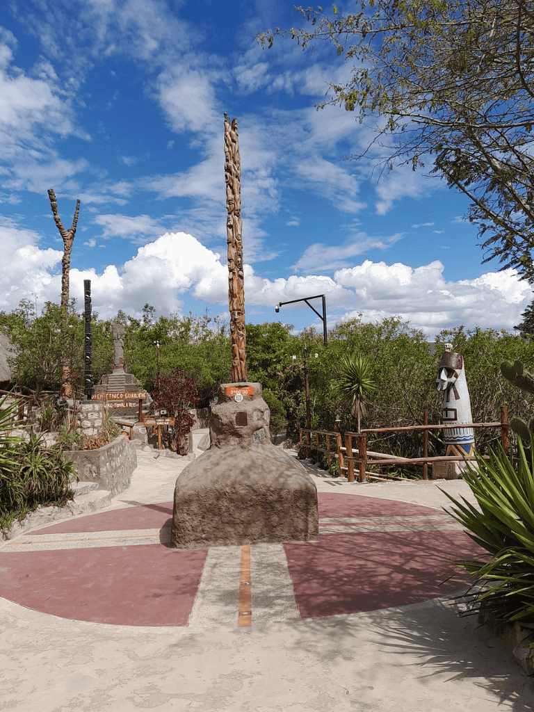 Ancient totem poles and indigenous art at QuestForDirections cultural site in Mexico.