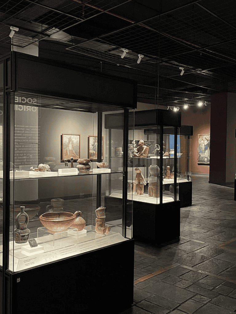 Ancient artifacts displayed in glass cases at the Quest for Directions museum.