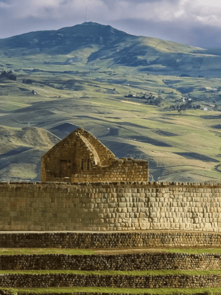 Ancient stone ruins with scenic mountainous background in Peru, showcasing rich cultural heritage.