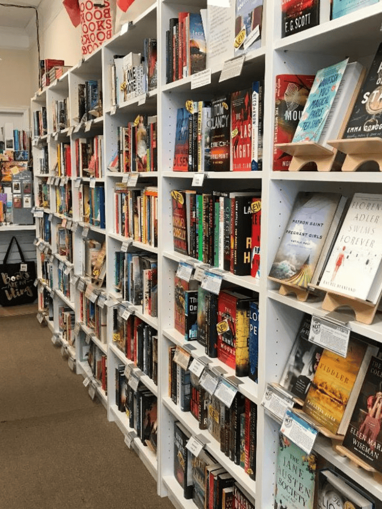 Mystery and thriller novels displayed on bookstore shelves for avid readers.