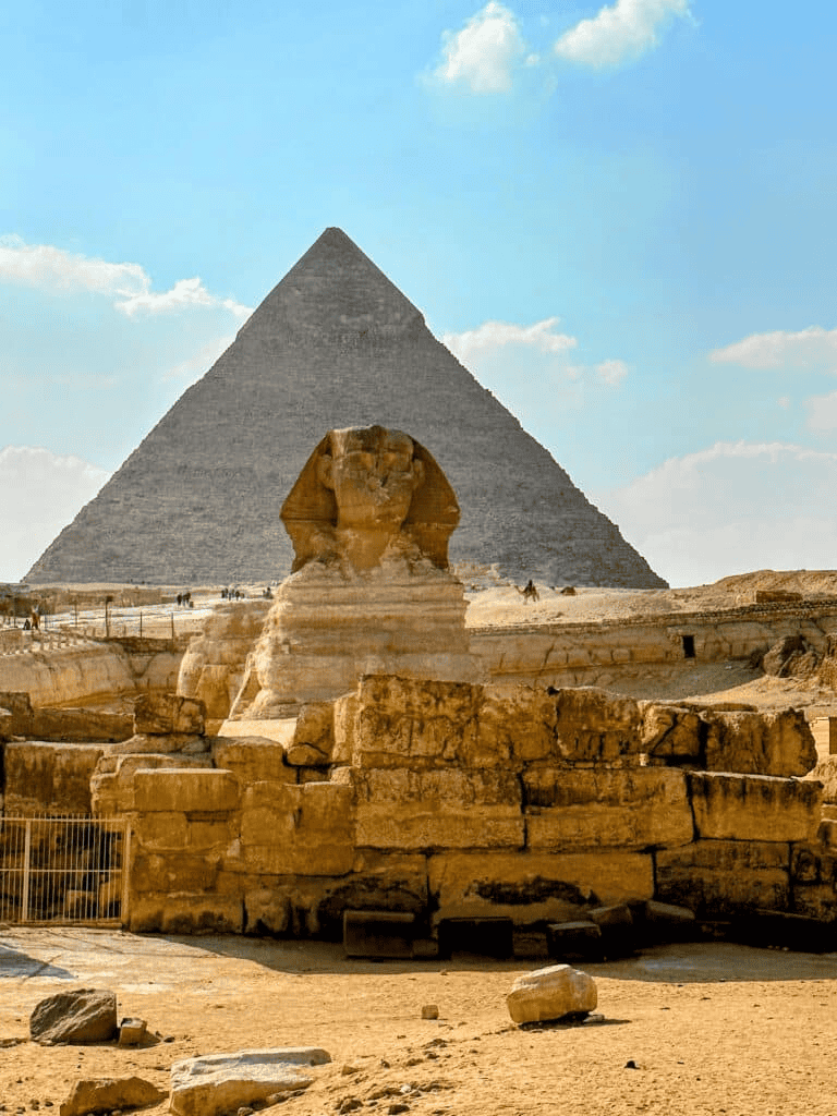 Ancient Egyptian pyramids and Sphinx at Giza archaeological site, Egypt.