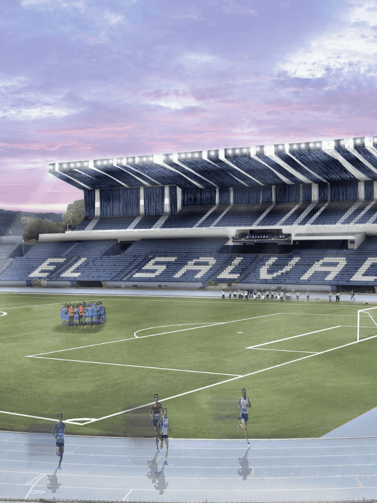 New stadium for El Salvador football team under a pink sky at dusk.