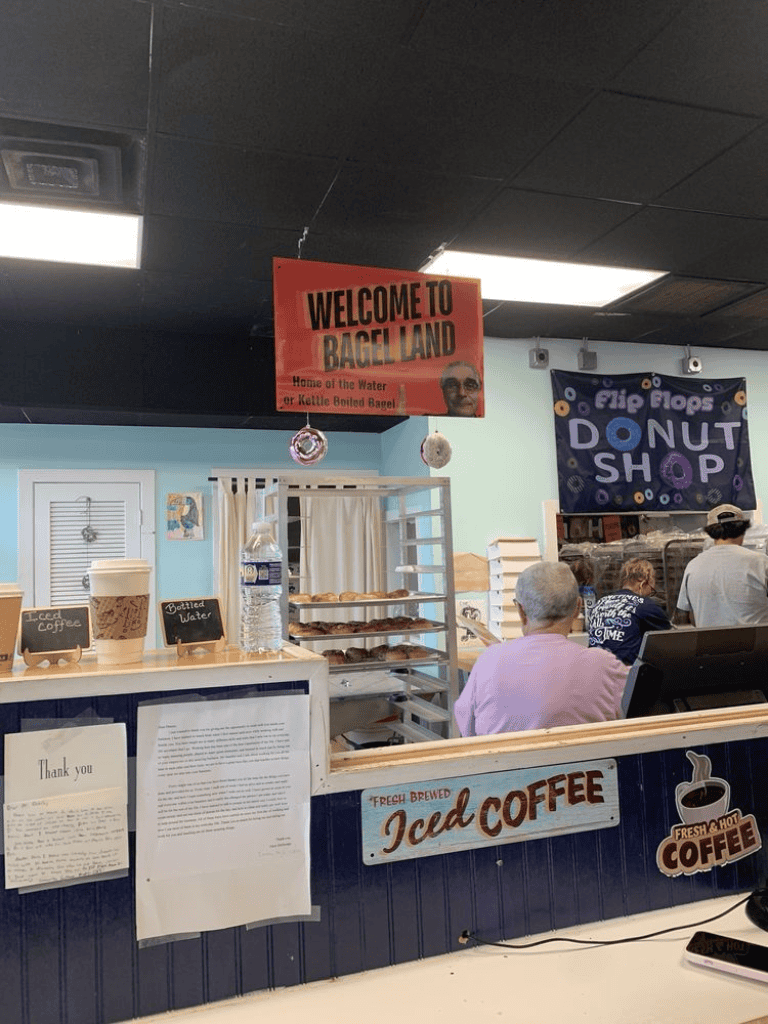 Fresh baked bagels and coffee shop in Bagel Land, with seating and menu options for drinks and snacks.