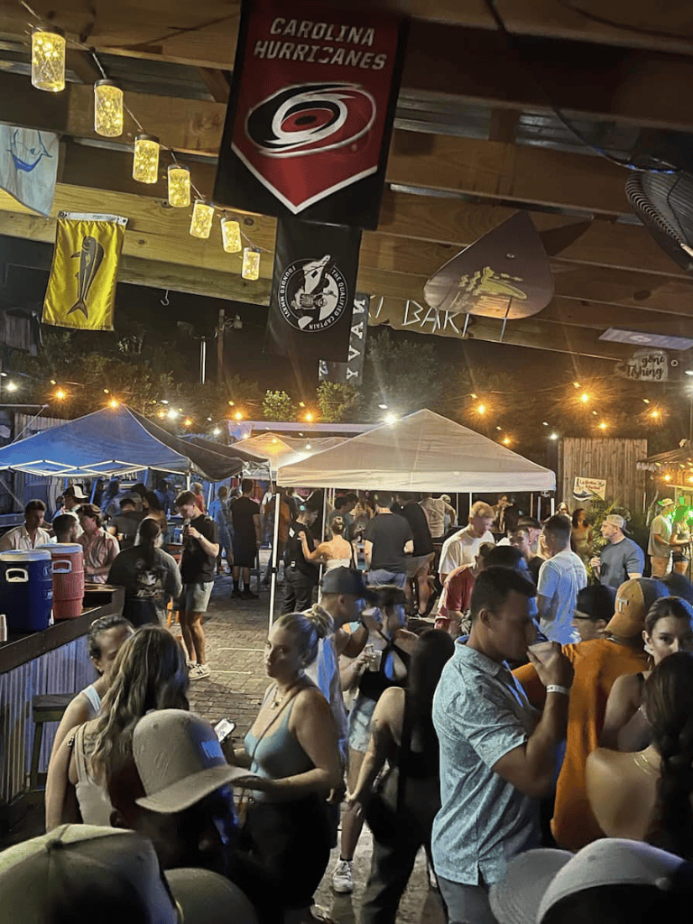 Festival atmosphere with lively crowd at Quest for Directions event, showcasing engaging entertainment and vibrant community gatherings.