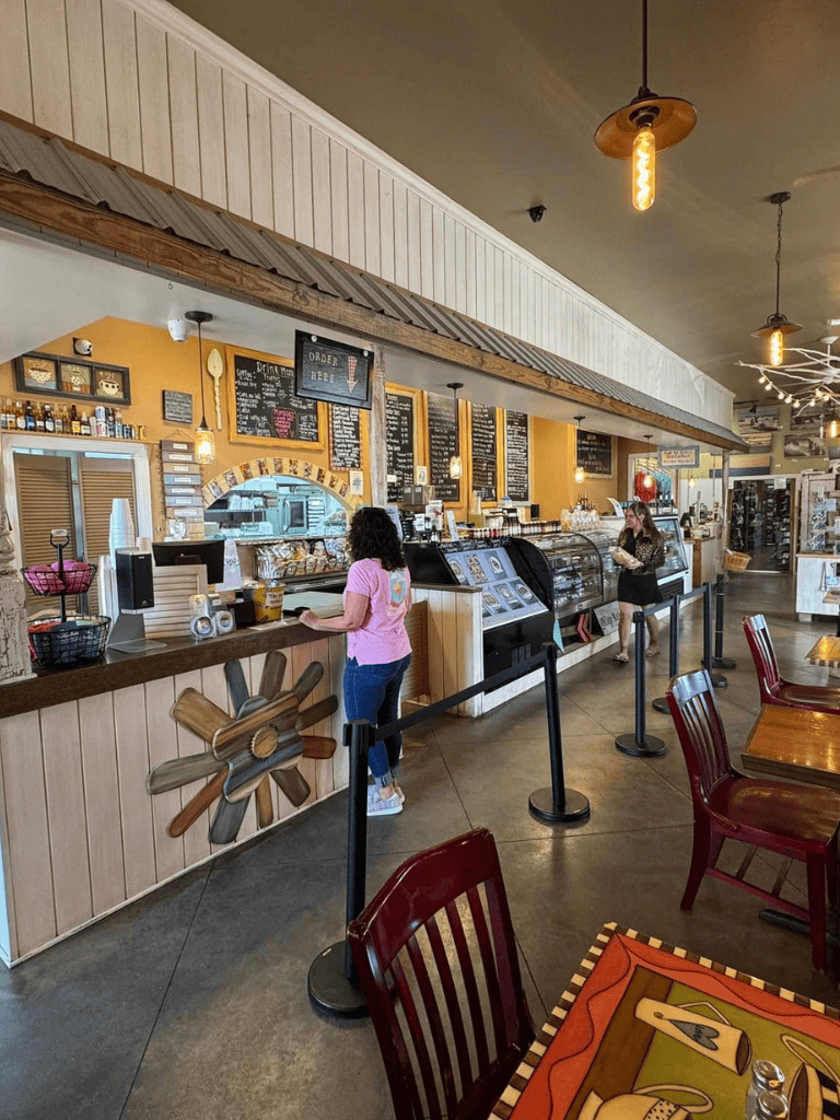 Freshly brewed coffee and pastries served at a cozy cafe with rustic decor.