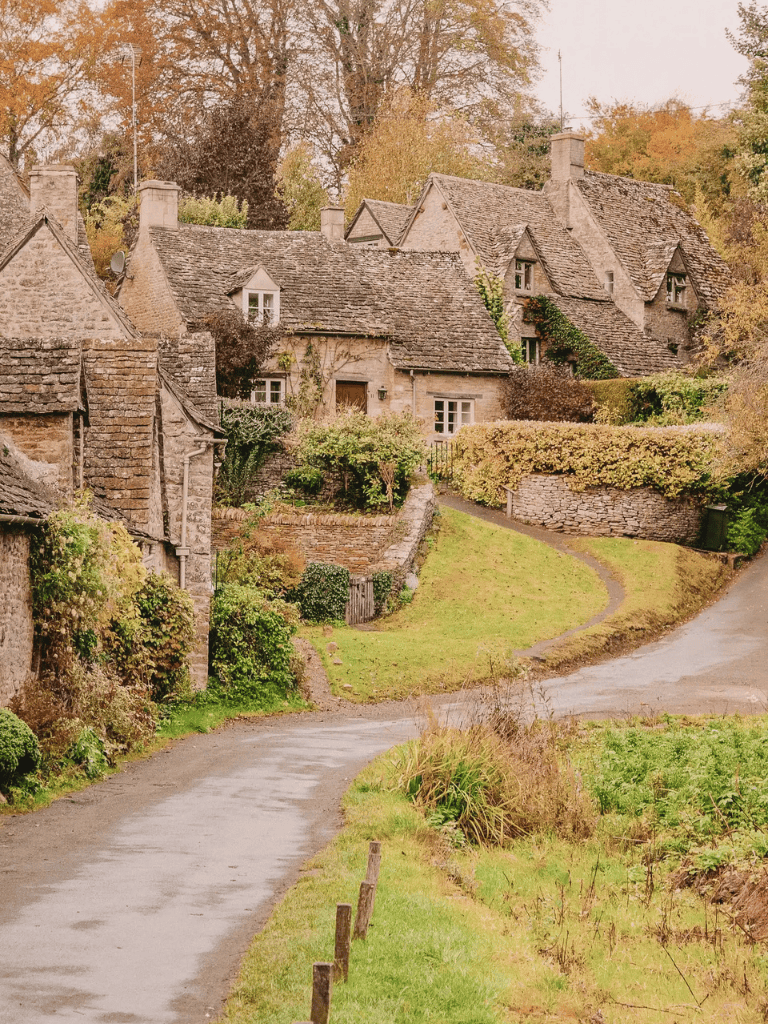 Charming historic cottage in Cotswolds with traditional stone architecture and scenic rural surroundings.