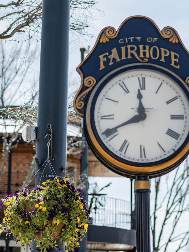 Historic clock in Fairhope showcasing scenic town charm and local community atmosphere.